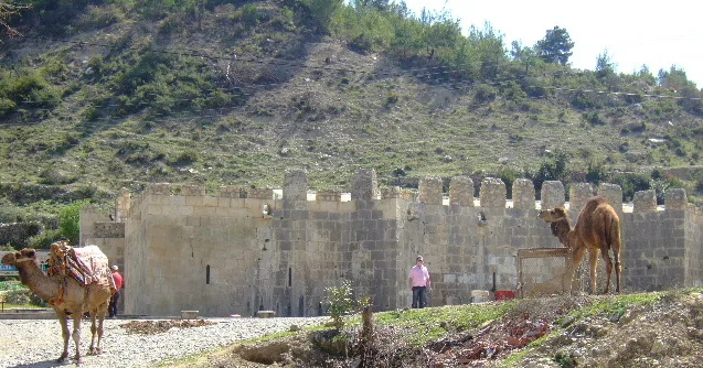 Stone exterior of Alara Han on a heritage trip from Alanya